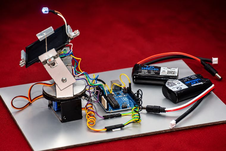 Arduino-controlled prototype with a servo-mounted solar panel